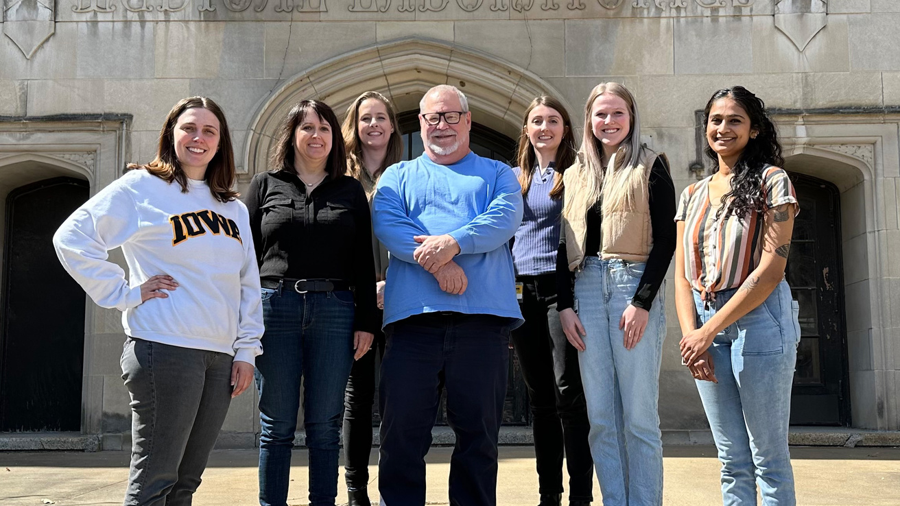 Harty Lab members standing in front of the med labs building